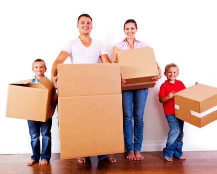 Moving van and packed boxes during house removals in Archway