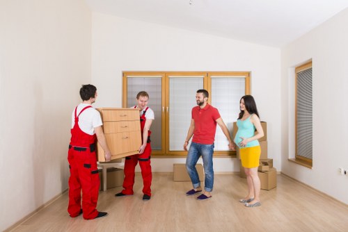 Professional movers handling compact household items in Archway