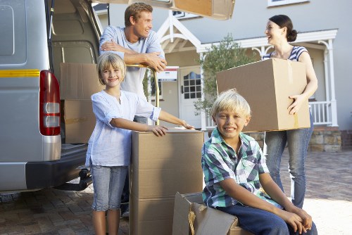 Professional movers handling furniture for removals in Archway